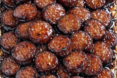 Thumbnail for My neighbor brought this to the potluck and the tray was licked clean. Sticky, sweet, and addicting. Just 4 ingredients!